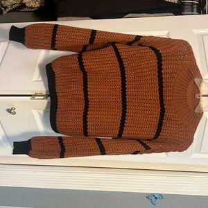 Fall sweater, size M. Dark autumn color with black stripes.